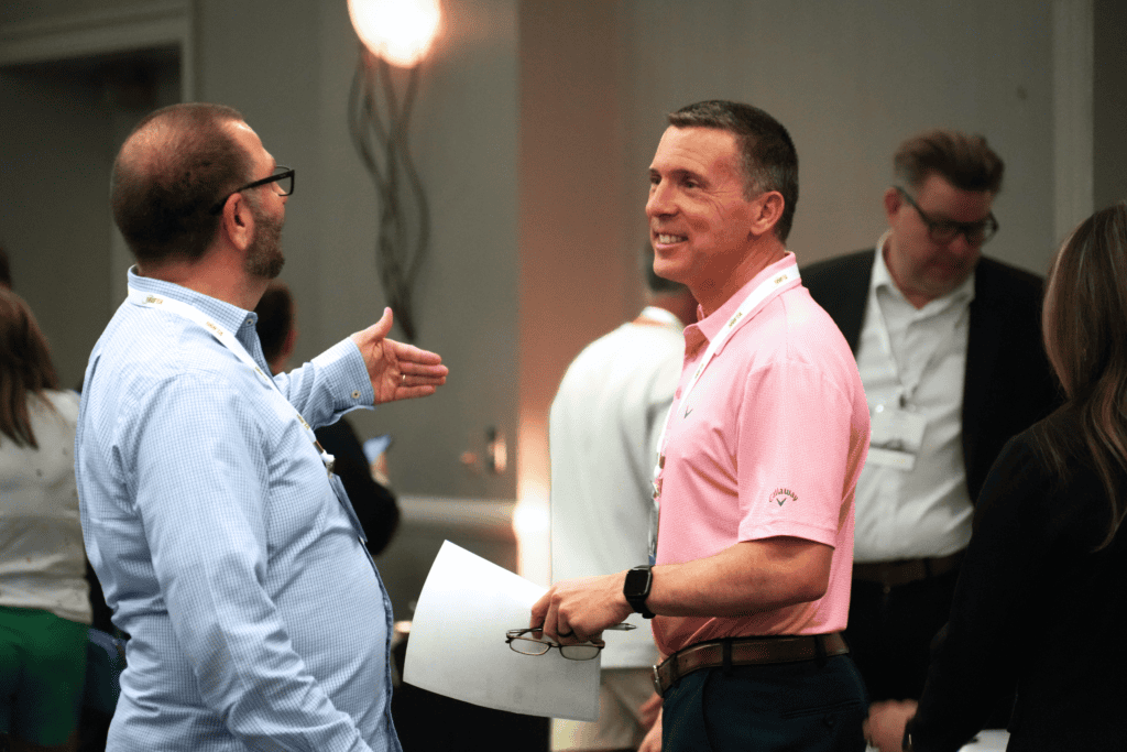 Chris Thacker speaking with attendees at a logistics and transportation networking event
