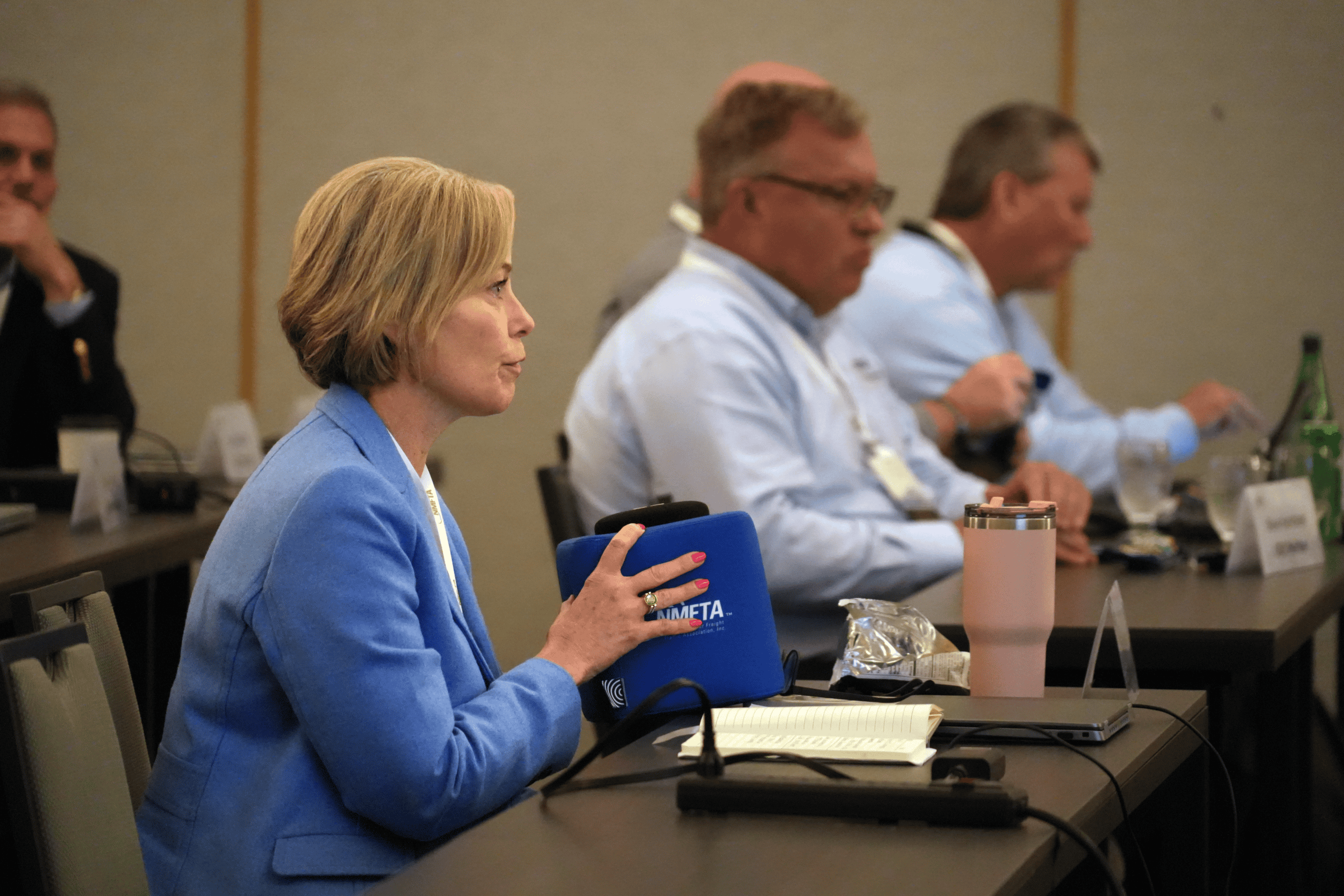 Kris McLennan listening and taking notes during an NMFTA trucking industry meeting