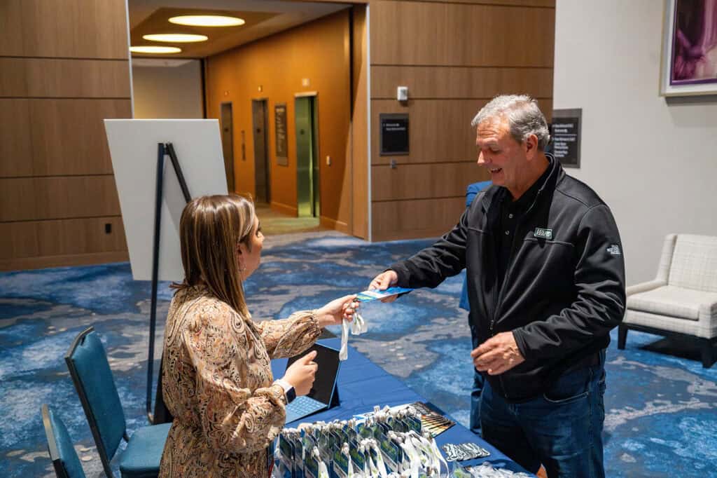 Mike Zupon checking in at an NMFTA event registration desk