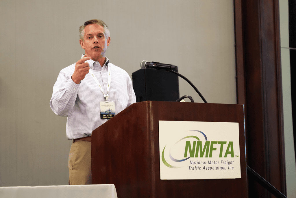 Clete Cordero speaking at an NMFTA podium during an industry event