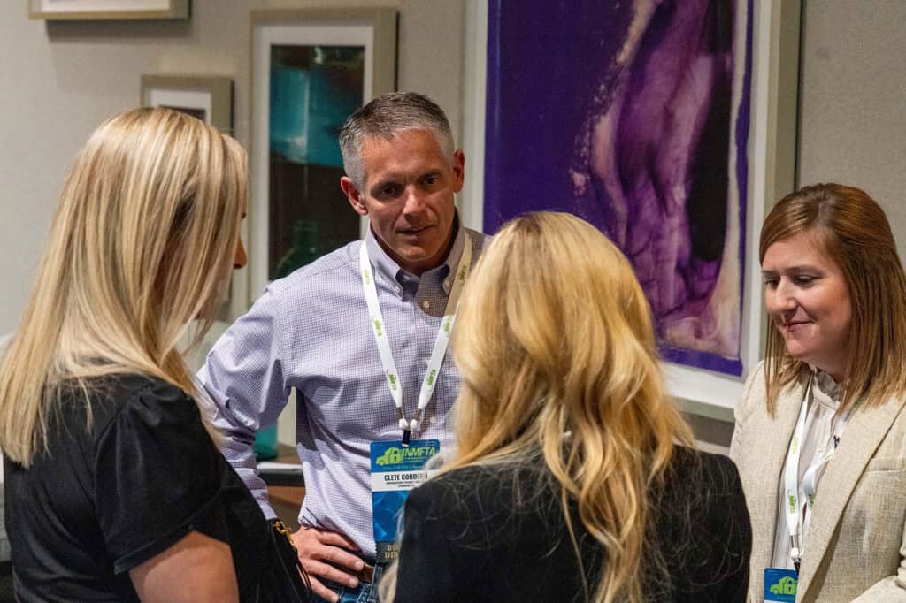 Clete Cordero speaking with attendees at an NMFTA cybersecurity conference