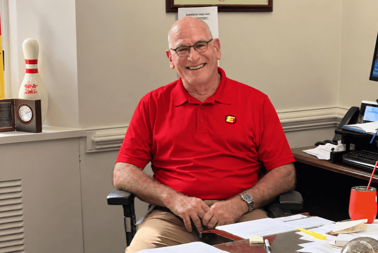 Richard Ellis sitting at desk